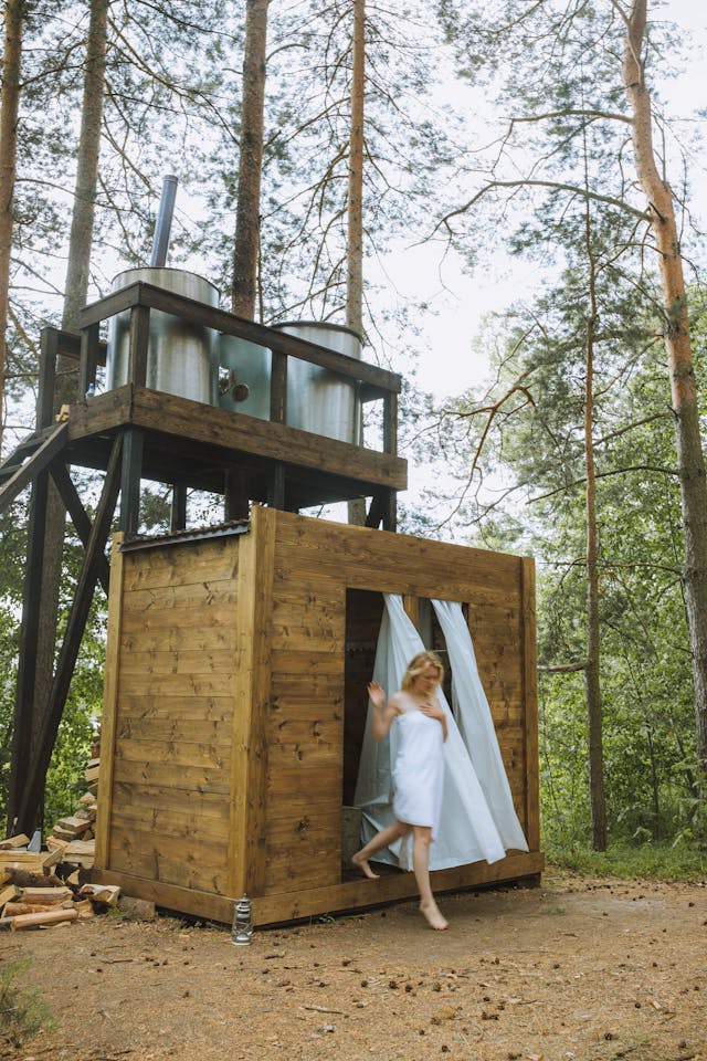 Photo by  Anastasia  Shuraeva: https://www.pexels.com/photo/woman-wrapped-in-white-towel-coming-out-from-a-wooden-bathroom-4993962/